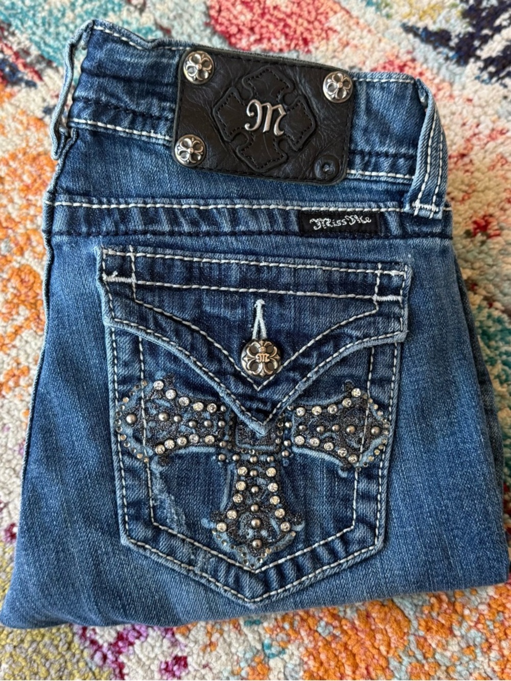 Miss Me Rhinestone Cross Flap Pocket Boot Cut Jeans
